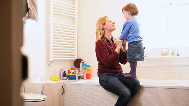 Mother playing with daughter