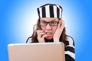 Criminal hacker with laptop on white