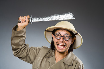Funny safari hunter against background