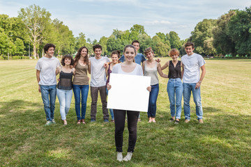 Obraz premium Group of ten friends. A girl holds white copy space