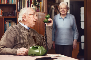 Senior couple at the telephone