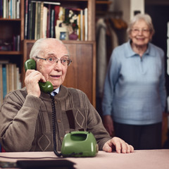 Senior couple at the telephone