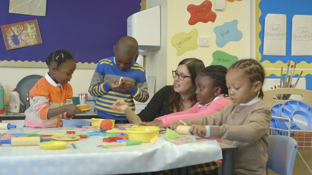 Teacher with student in classroom