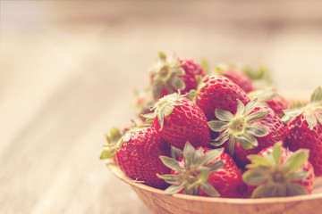 Strawberries in a basket in the garden