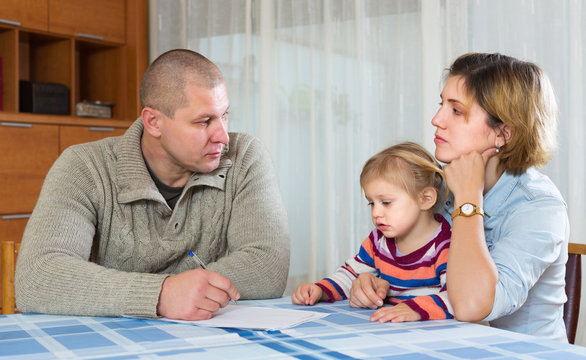 Serious parents discussing parental guardianship