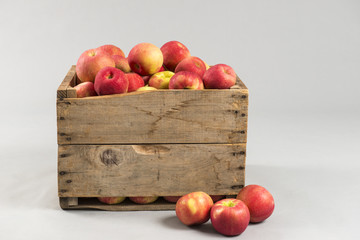 woodern crate full of apples