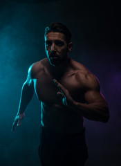 Fototapeta na wymiar Silhouette Topless Athletic Man in a Fighting Pose