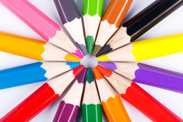Fototapeta premium Colorful wooden pencils in the circle isolated on white