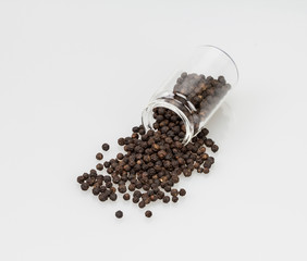 closeup dried black pepper on white background