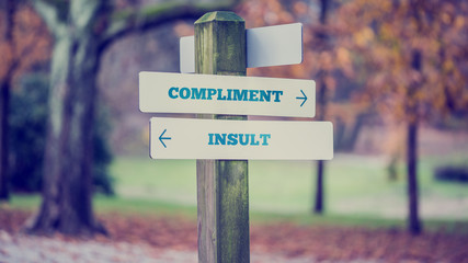 Words Compliment and Insult in a conceptual image