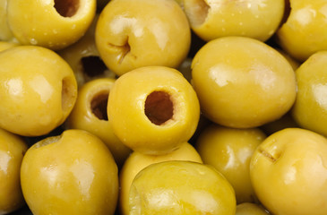 Abstract background: green pitted olives.