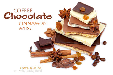 Various pieces of chocolate with nuts, raisins and coffee beans