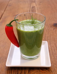 Green spinach smoothie and sweet red peppers,