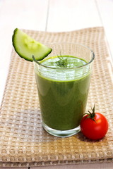 Green smoothie spinach, cucumber and small red tomato