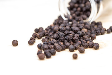 closeup dried black pepper on white background