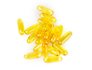 Closeup yellow soft gelatin supplement fish oil capsule
