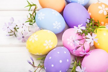colorful easter eggs and branch with flowers