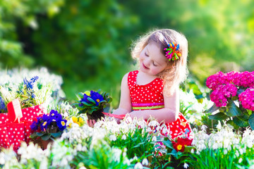 Little girl working in the garden