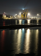 Night view of a port with lights reflection in water, Swinoujscie, Poland.