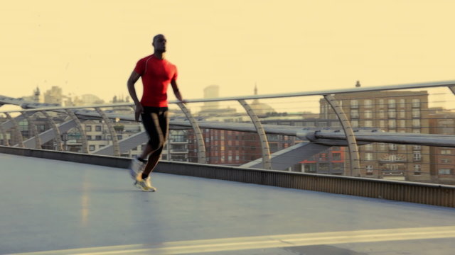 Male starting positions on millenium bridge London, UK and sprint over bridge