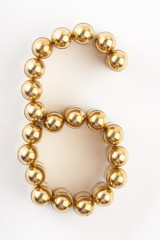 Numbers made of 9 mm cartridges on white background