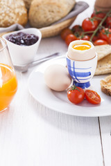 English breakfast on white wooden table