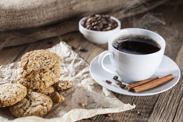 Delicious coffee with sweets on a wooden table