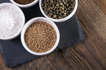 Aromatic spices in white bowls