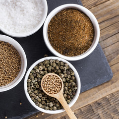 Aromatic spices in white bowls