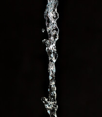 Obraz na płótnie Canvas spray water on a black background