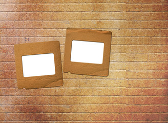Old paper slides for photos on rusty abstract background