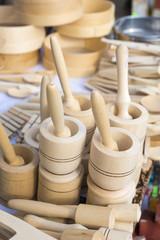 Wooden mortars and pestles for sale at a market stall