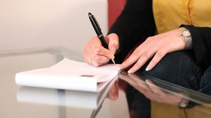 Female office worker taking notes
