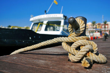 Fototapeta premium boat tied with a rope on a mooring
