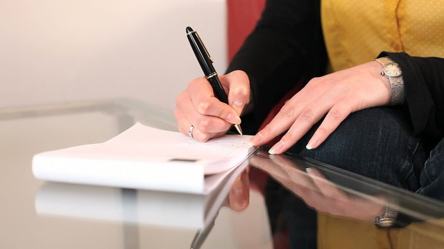 Female office worker taking notes