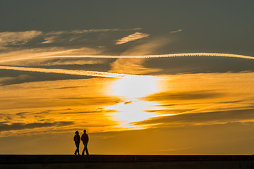 Couple walking at sunset