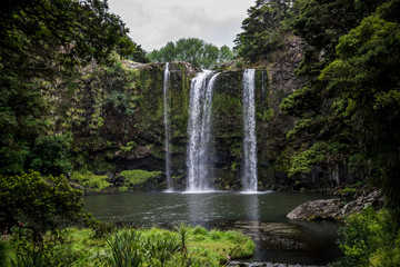 A scenic view of Whangarei waterfall and pond underneath