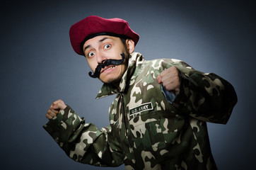 Funny soldier in military concept