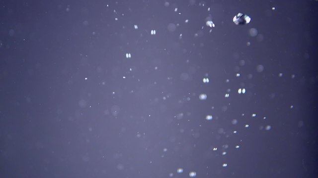 Slow motion water and fluids bubble and float in this motion background