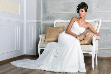 Portrait of young luxurious brunette bride