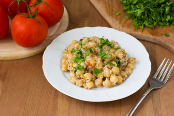 Chickpeas with rice and tomato sauce. Healthy vegan food