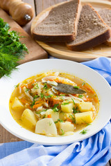 Traditional Russian cabbage soup with proso millet and potato