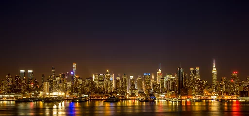 Rolgordijnen New York City Manhattan midtown buildings skyline night © blvdone