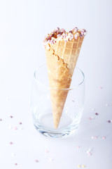empty ice cream cones with colorful sprinkles