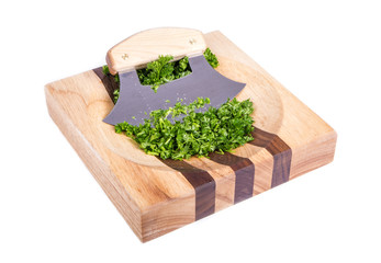Ulu Knife and Chopped Parsley on a Wooden Block