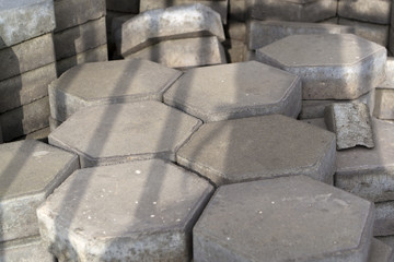 Stack of grey hexagonal tiles
