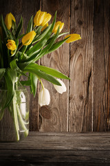 tulips over wooden background