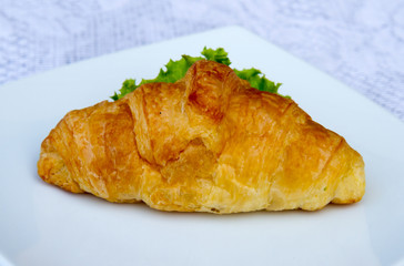 Sandwich croissant with vegetable.