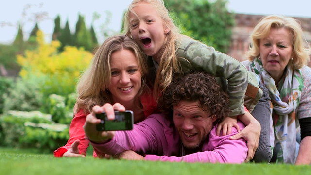 Man taking selfie with family