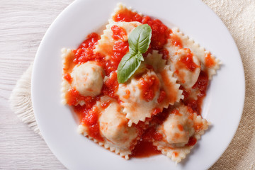 Ravioli with tomato sauce close-up horizontal top view
